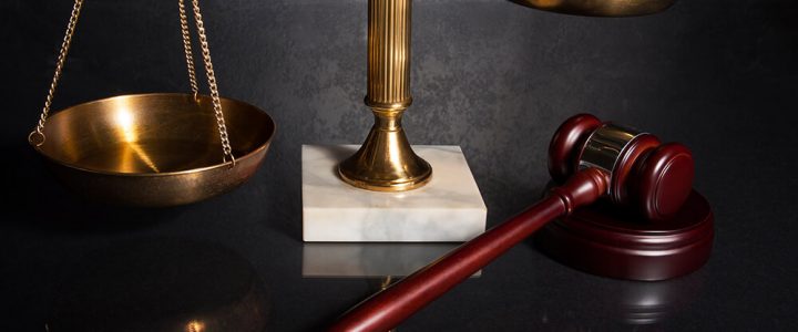 Gavel and brass scale representing white collar criminal defense