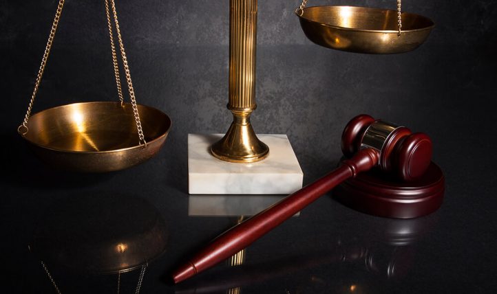 Gavel and brass scale representing white collar criminal defense